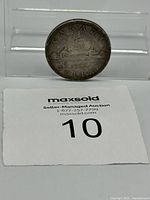 Full lot view showing obverse side with canoe design and date 1936