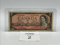 Front of 1954 $2 note showing serial number 1357663 and Queen Elizabeth II portrait