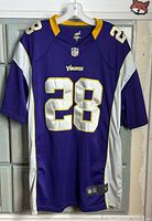 Front view of jersey showing number 28 and Vikings logo