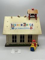 Front roof view of Fisher-Price Play Family Schoolhouse with included figure