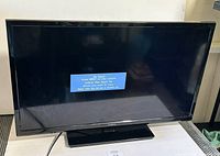 Front view showing screen powered displaying 'No Signal' message