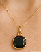 Pendant on chain showing size and appearance when worn