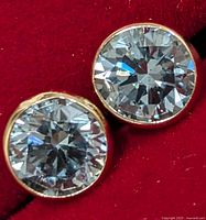 Front view of both bezel-set lab diamond studs