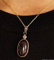 Pendant on chain showing size and appearance when worn