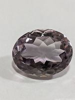 Front view of oval faceted amethyst showing crown facets