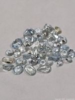 Group of loose pale blue faceted aquamarine stones
