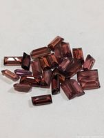 Group of rectangular garnet stones on white background