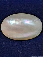 Top view of oval mabe pearl showing lustre