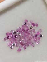 Cluster of small round pink sapphires close-up