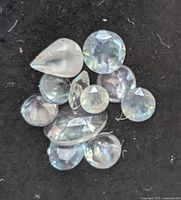 Close-up of loose alexandrite stones on black background