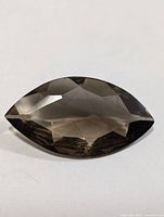 Top view of faceted marquise smoky quartz