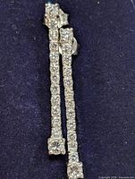 Front view of both earrings showing CZ stones and drop length