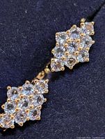 close-up of one earring cluster front