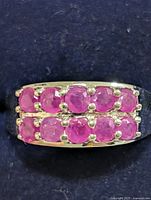 Front view of sterling silver band with two rows of rubies