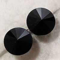 Front view of both earrings showing round faceted black onyx stones