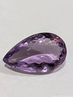 Overall view of faceted pear-shaped amethyst