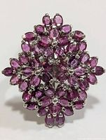 Front view showing floral ruby cluster design