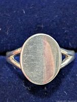 Front view of silver ring in box