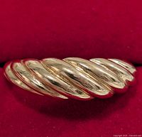 Close-up of ribbed twist design on silver ring