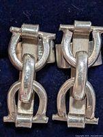 front view of both silver linked earrings