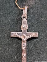 front view crucifix pendant showing corpus and INRI