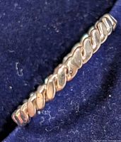 Close-up of twisted rope design on silver ring