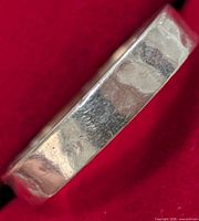 Close-up of exterior hammered texture on silver band