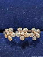 Front view showing flower motif on silver ring