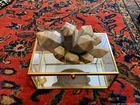 Overall view of glass box with ceramic crystal cluster