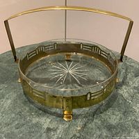 round brass tray with glass insert, handle down
