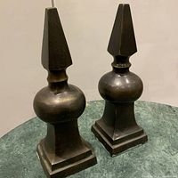 Both metal bookends side by side