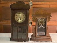 Both antique clocks side by side