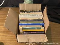 Open box showing all books upright