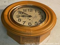 Front view closed showing wood bezel and dial