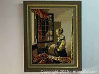 Full view of framed needlepoint