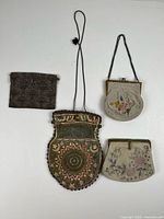 All four purses laid flat for size comparison and overview