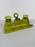 Oblique view showing uranium glass inkwell, three reservoirs, one lid open