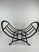 Log holder unfolded showing curved cradle and feet