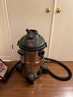 Full view of Shop-Vac with hose attached