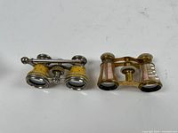 Both opera glasses side by side showing overall design differences