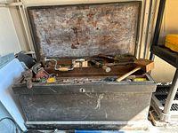 Closed wooden chest front view in shed