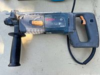 Left side view of Bosch B8850 Bulldog rotary hammer drill with auxiliary handle