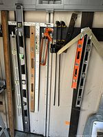 Overall wall with levels, squares, clamps, hacksaw