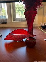 Group shot of vase, shell bowl, tealight holder, and feathers