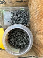 Containers of drywall screws