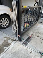 Entire set attached to post: coiled steel hose, Gardena sprinkler, wand