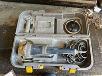 Full kit in open carry case showing grinder, handle, guard