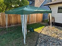 Shelter fully erected in yard showing overall condition