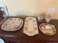 Stack of Ball Point Chintz plates and tray, two egg coddlers, saucer with shoe