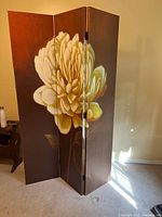 Partition partially opened showing two panels and floral print